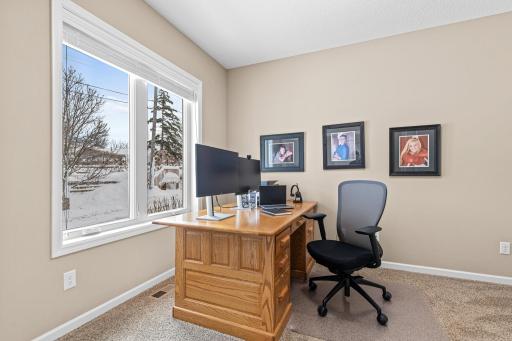 Double frosted glass doors off the foyer open to the main floor office, which includes a closet and could easily serve as a 4th bedroom or nursery if desired.