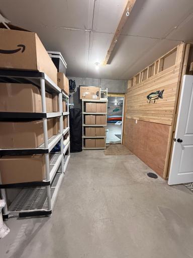 Storage/utility with door leading to the the 792 sq. ft. man cave.