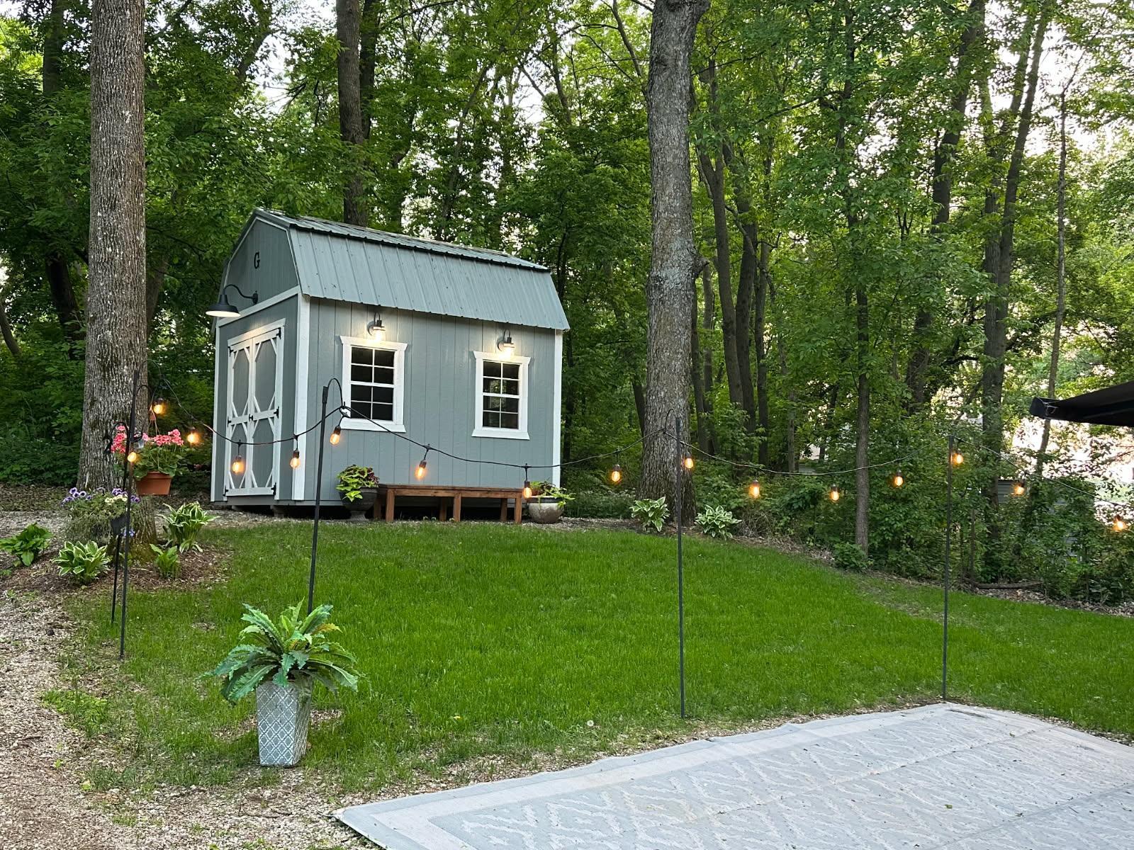Unit 63 has pretty trees, green grass, a great parking pad for a heavy RV and a nice level pad for a shed OR PARKING.