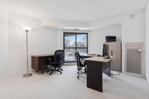 The second bedroom offers access to the private balcony.