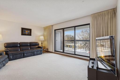 Access the private balcony from the sliding glass door.
