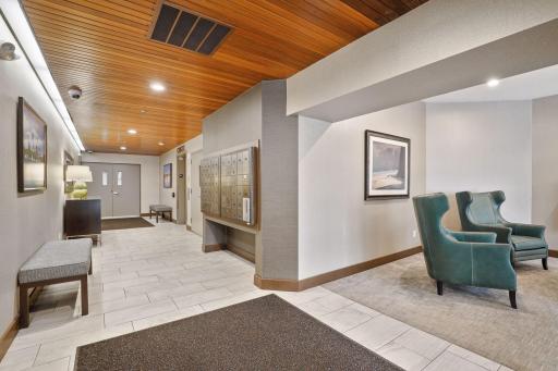 The lobby also features a lovely community sitting room, access to the main level garage, and an elevator.