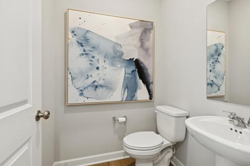 (Photo is of a model home, finishes will vary) Right off the foyer is a convenient powder room to accommodate the needs of the whole family and visiting guests alike.