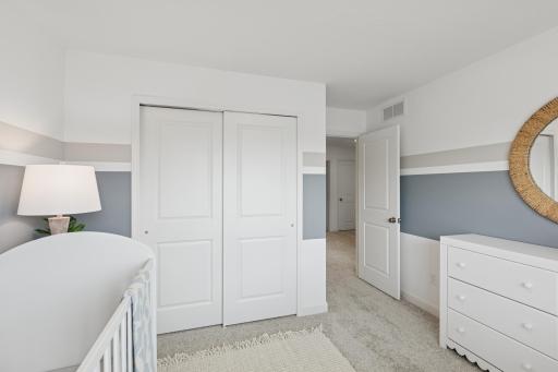 (Photo is of a model home, finishes will vary) Another angle of a secondary bedroom.