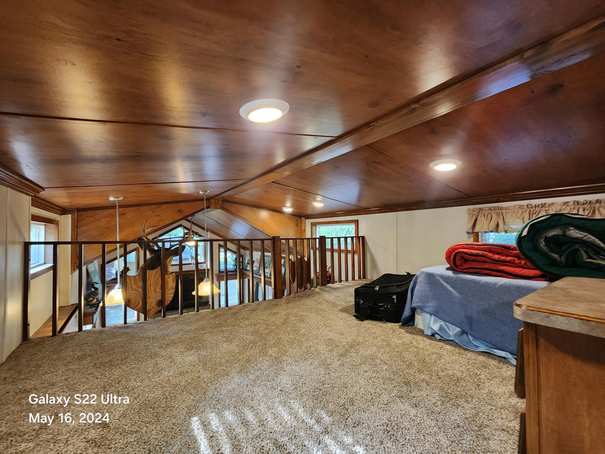 Upper level of Park Model has private bedroom area and additional loft