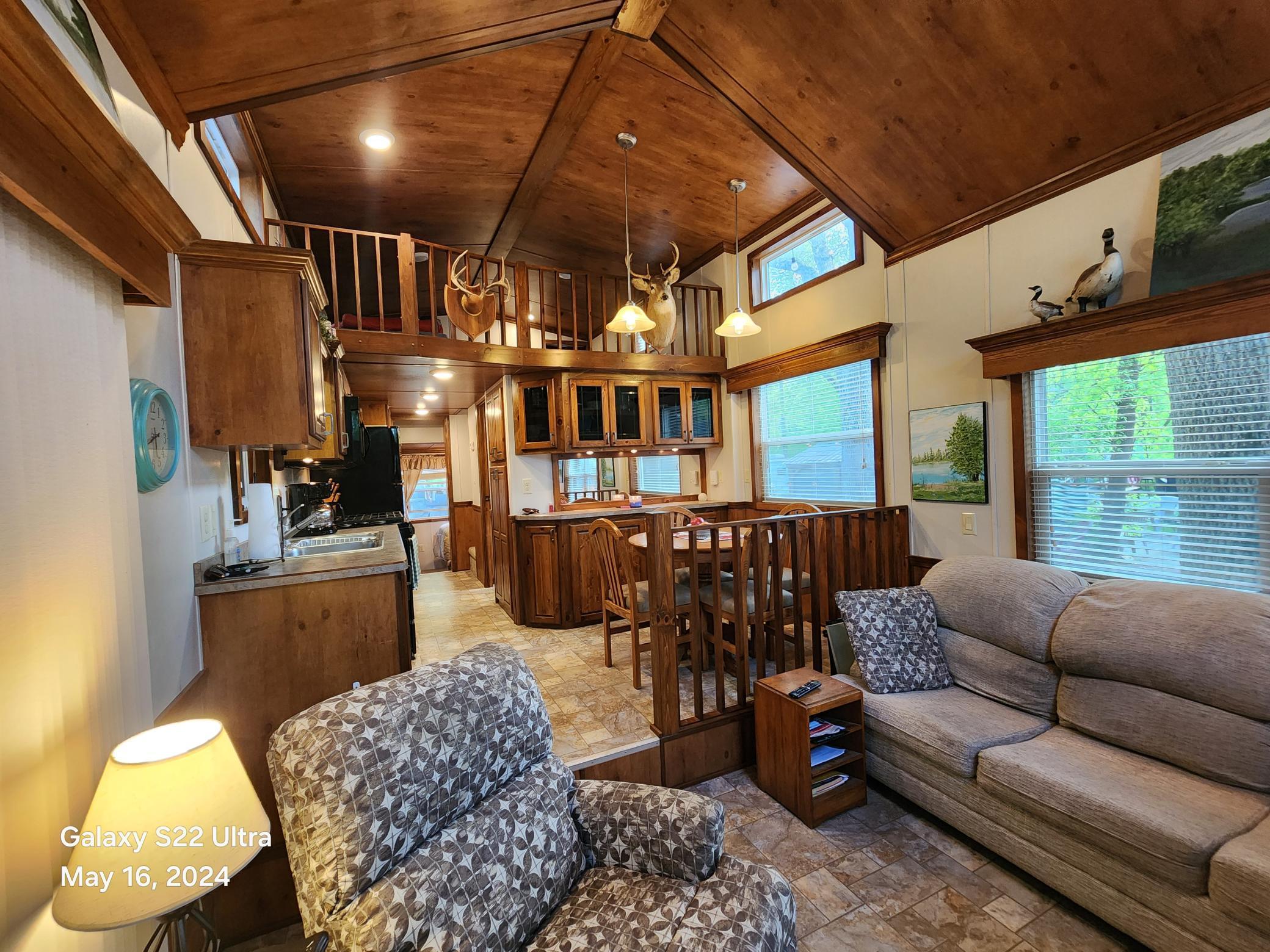 Cabin feeling at the lake with a bedroom, sleeper sofa, loft plus private bedroom area in loft