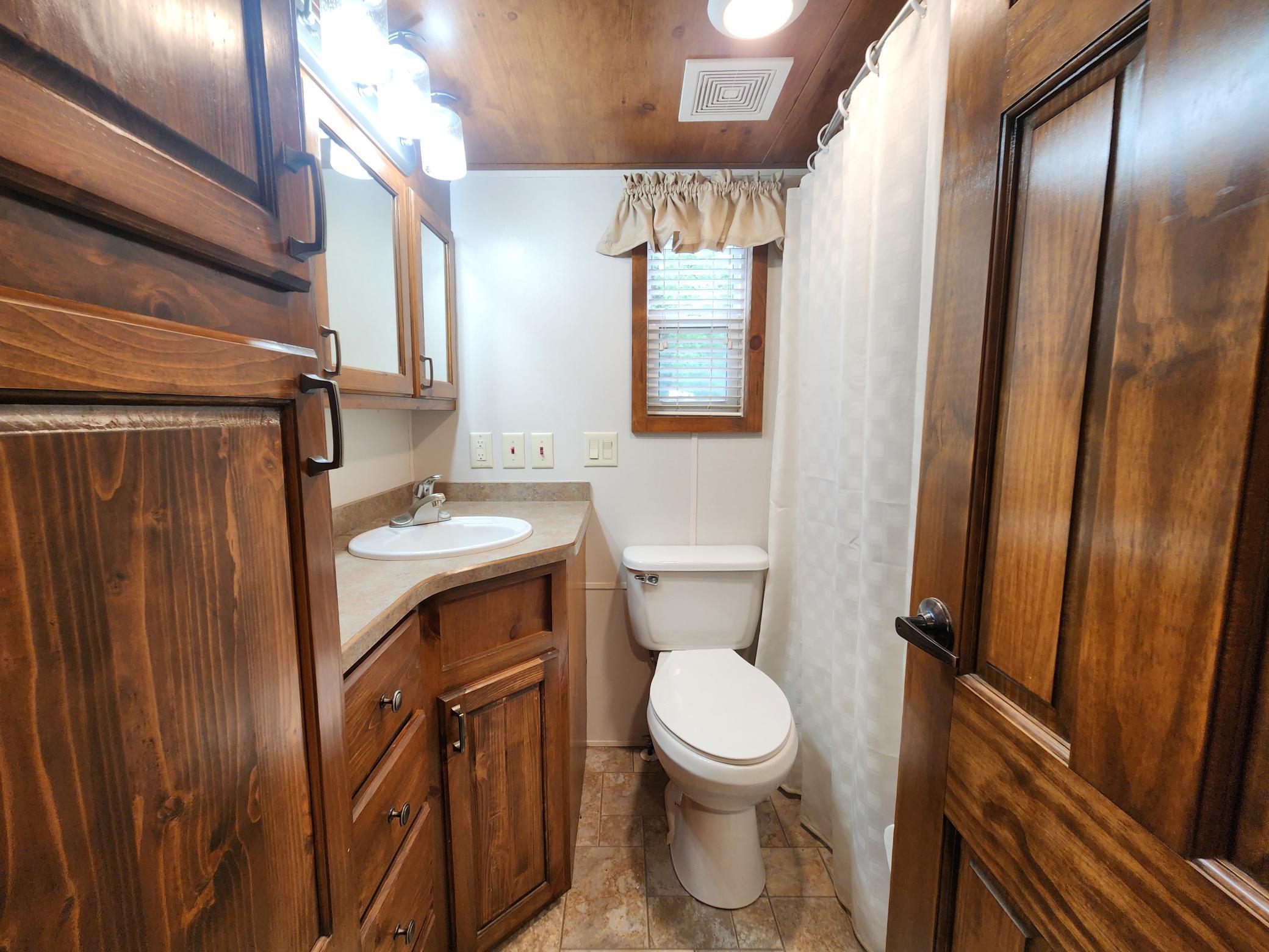 Bathroom with full tub and shower and plenty of storage