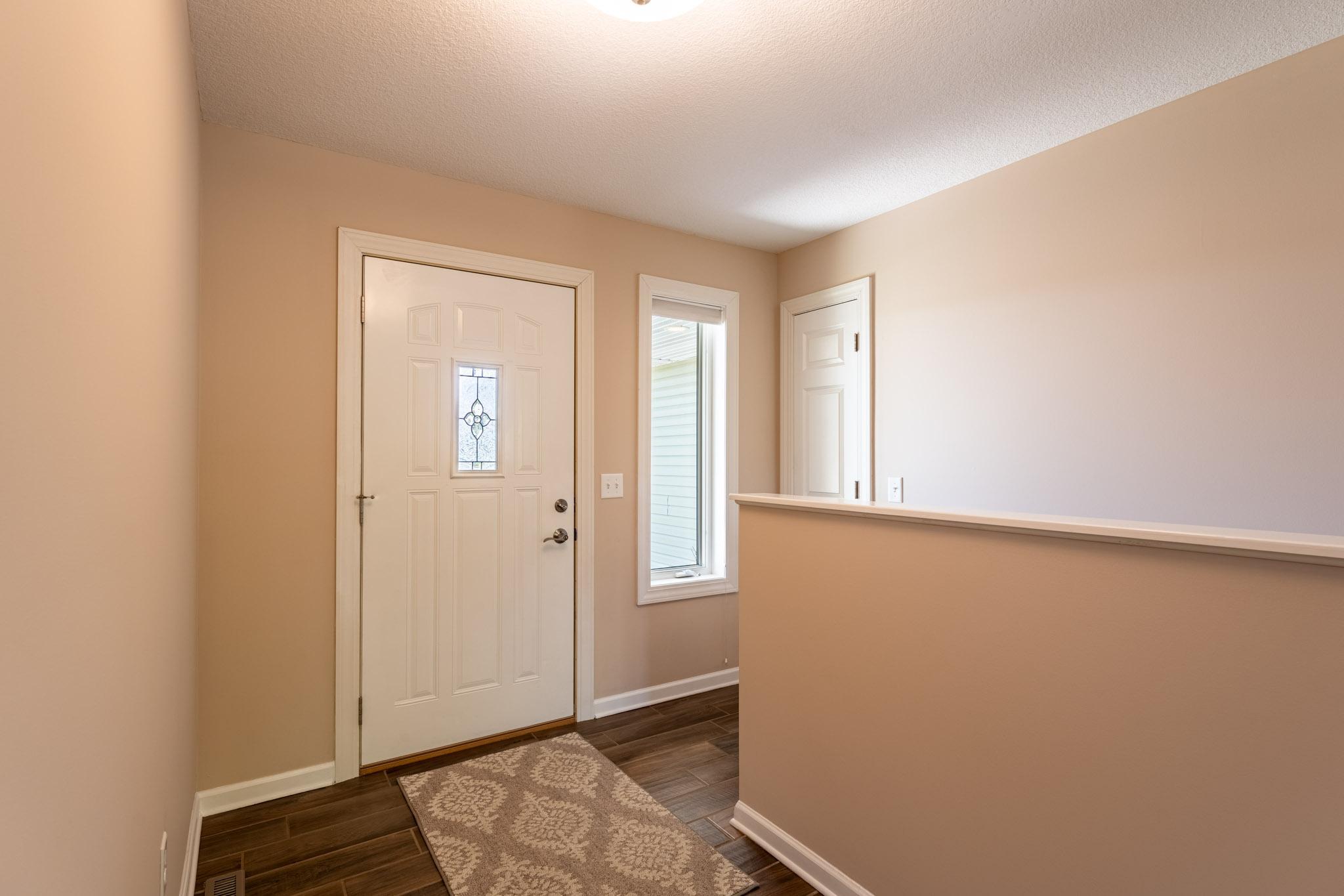Foyer with coat closet.
