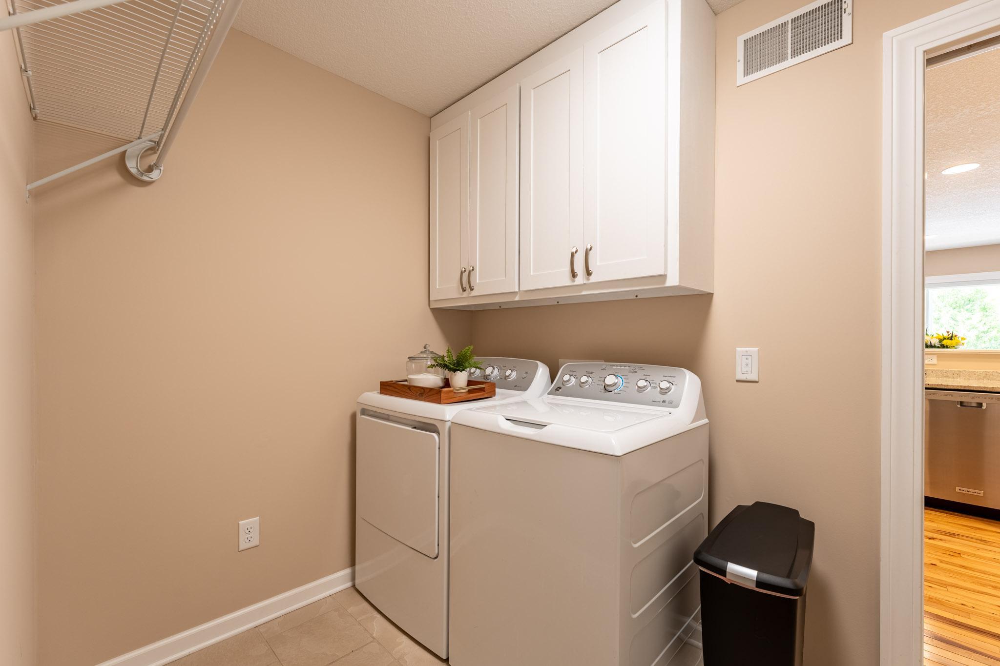 Main floor laundry room, ritght off of the kitchen. Washer & Dryer included.