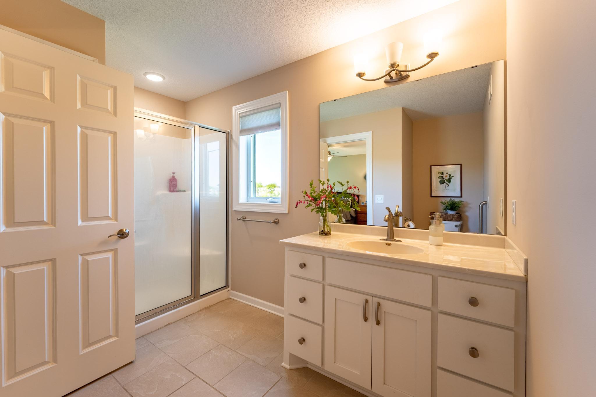 Owner's suite 3/4 bath with walk-in shower.
