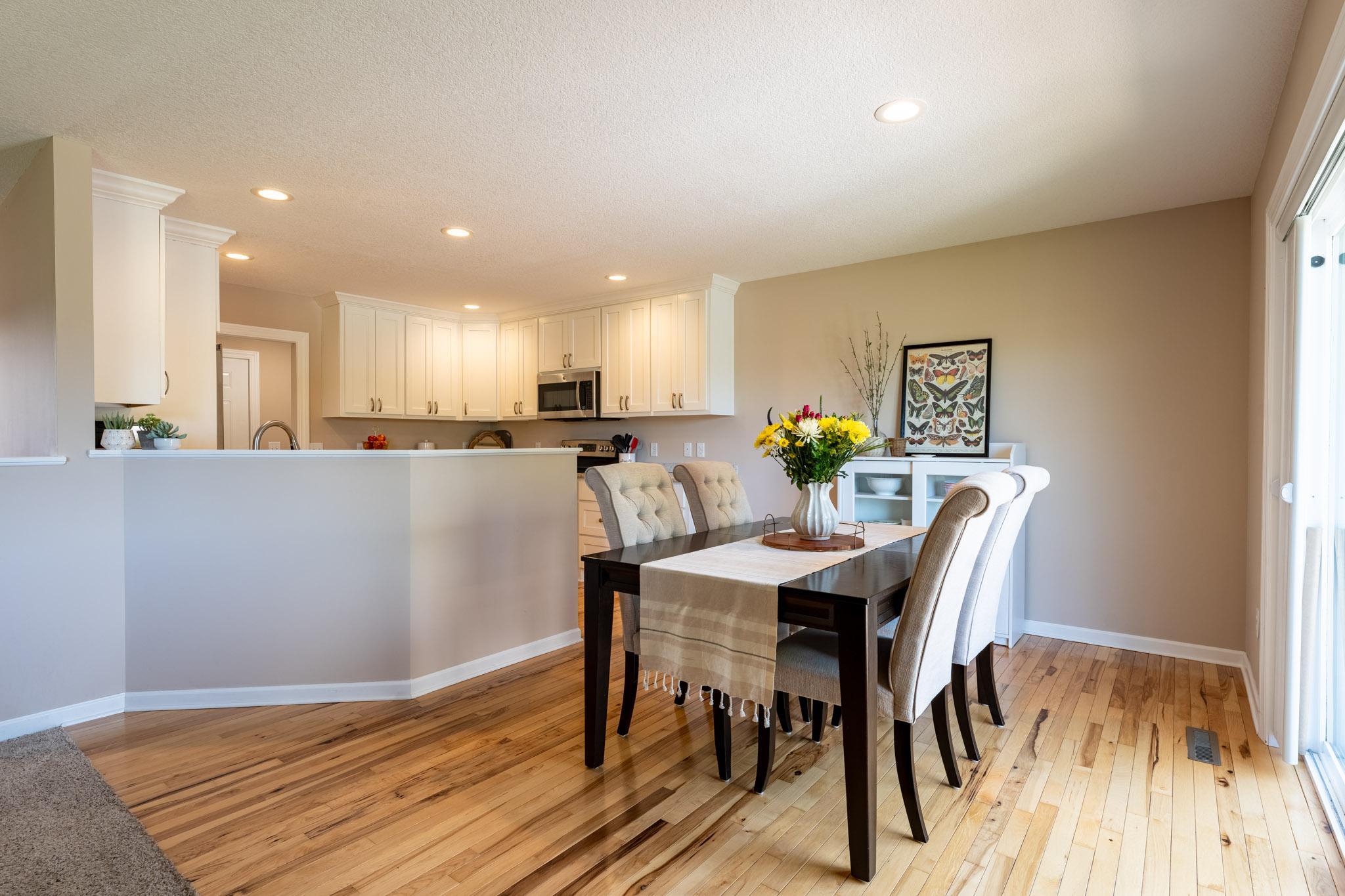 Dining room with Hickory hardwood floors.