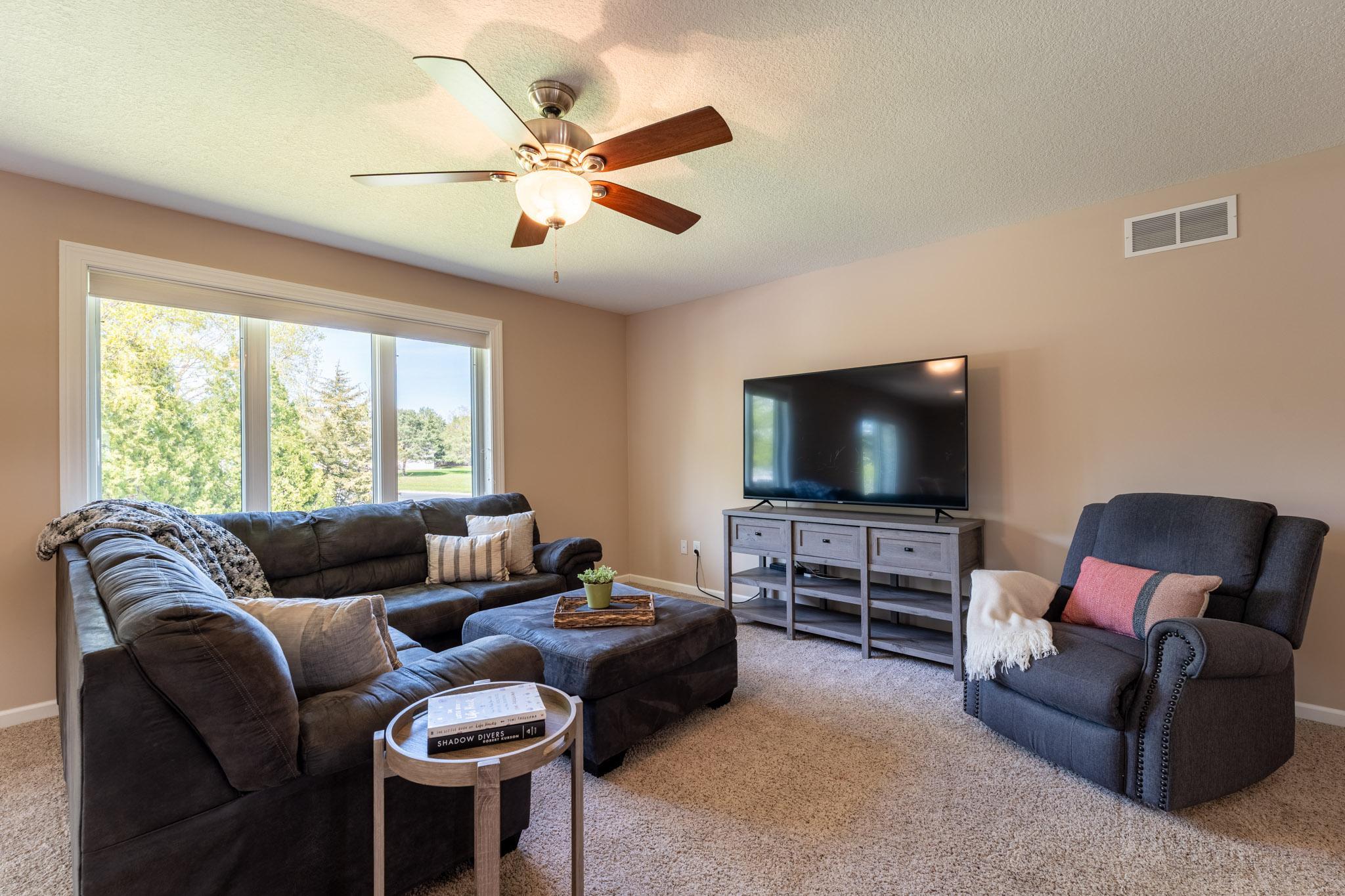 Livingroom with lots of natural light. Professionally painted throughout May 2026.