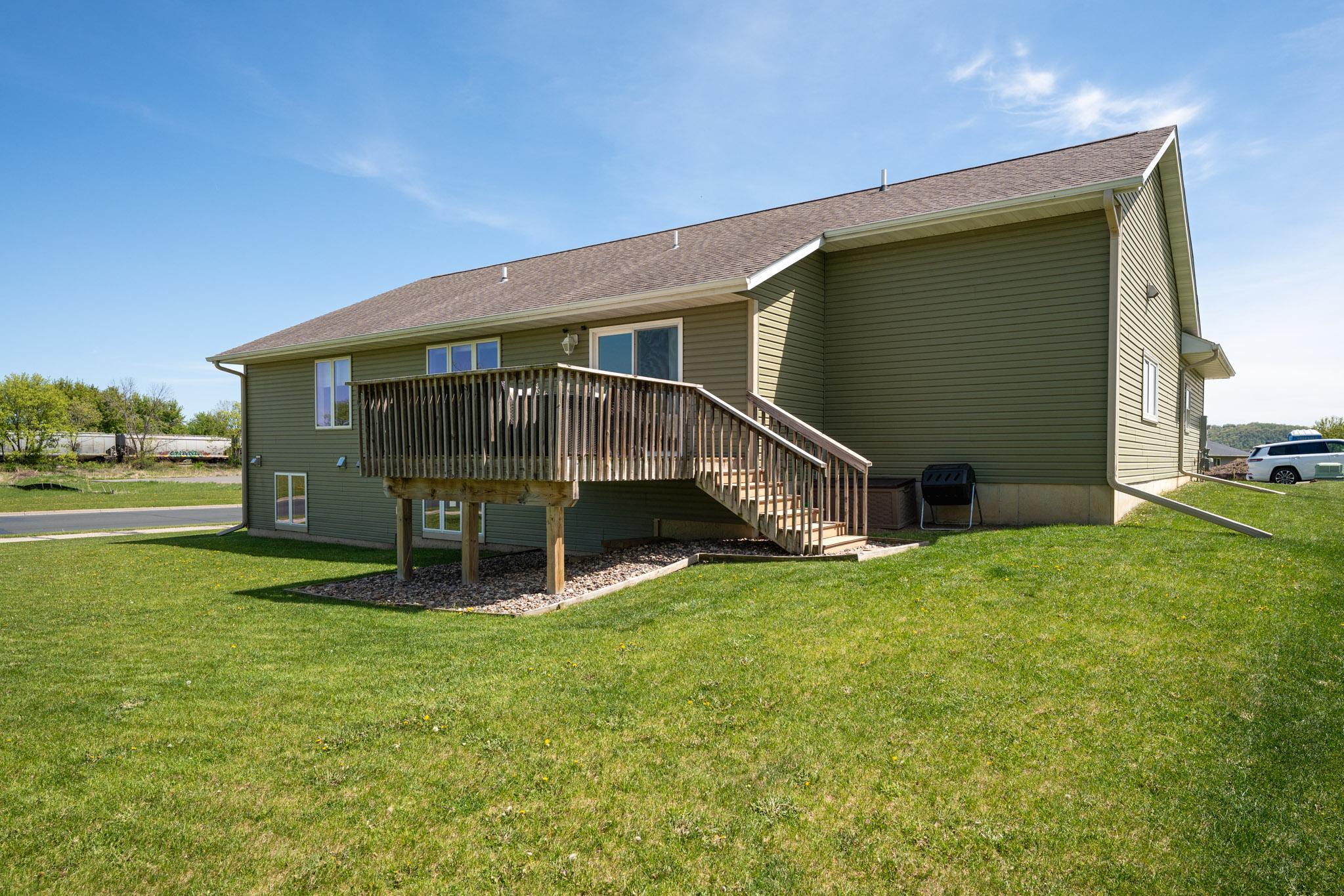 Large deck with stairs down to the backyard.