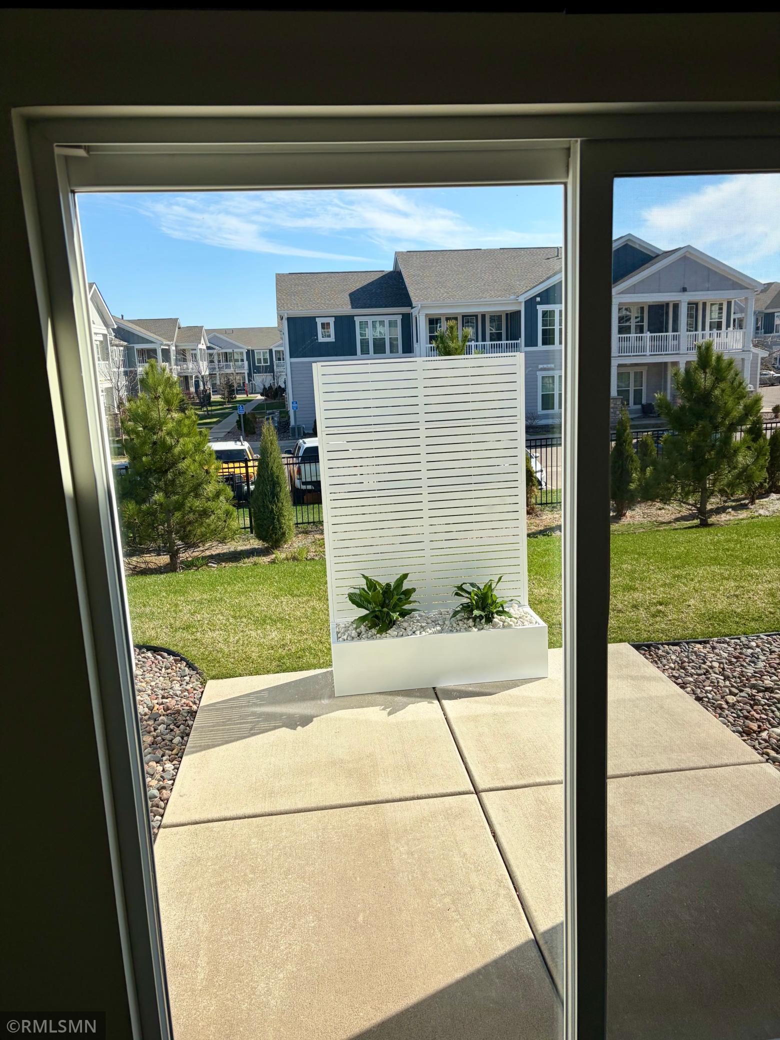 Privacy screen stays and the trees behind are growing quickly!
