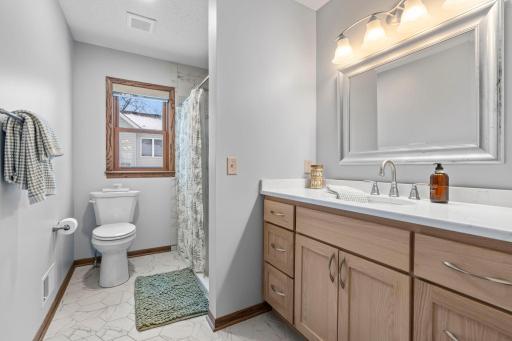 Updated bathrooms - New vanity, countertops, sink, tiled flooring and tiled shower.