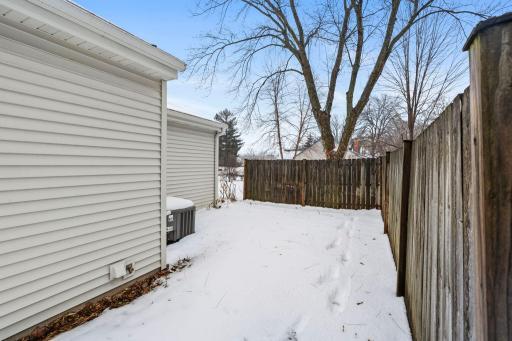 Private backyard fence offers opportunity for backyard patio retreat.