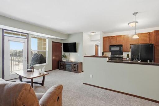 An open view between the living room and kitchen creates a welcoming flow—perfect for relaxing or entertaining.