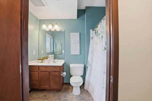 A clean, well-appointed bathroom that offers convenience and style for guests or everyday use.