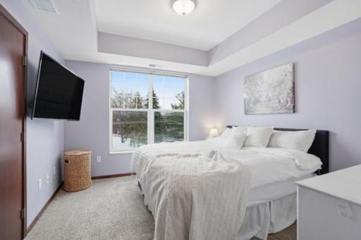 A calm and comfortable primary bedroom offering generous space to unwind and recharge at the end of the day.