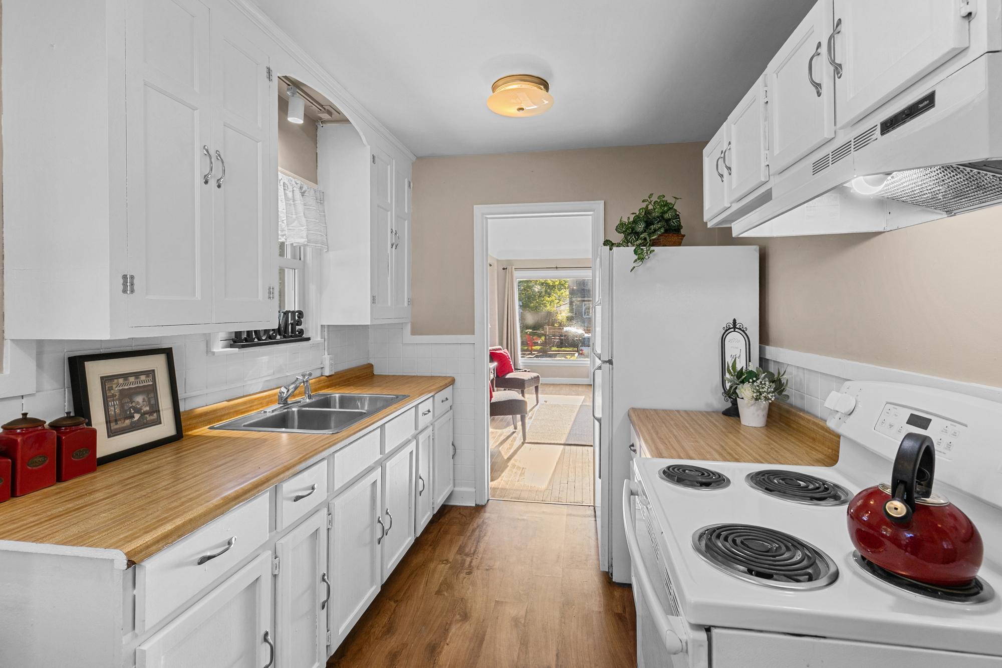 Kitchen cabinets and walls were just freshly painted.