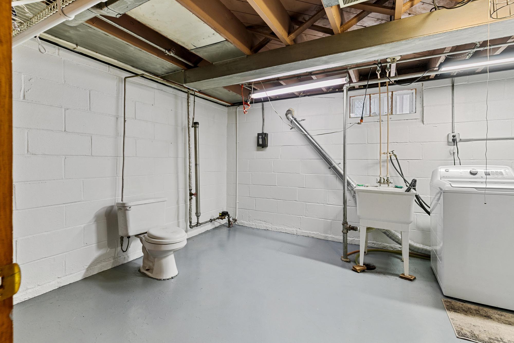 The laundry room toilet does leak and the water to it is turned off. There is obviously plenty of space for you to add a second bathroom.