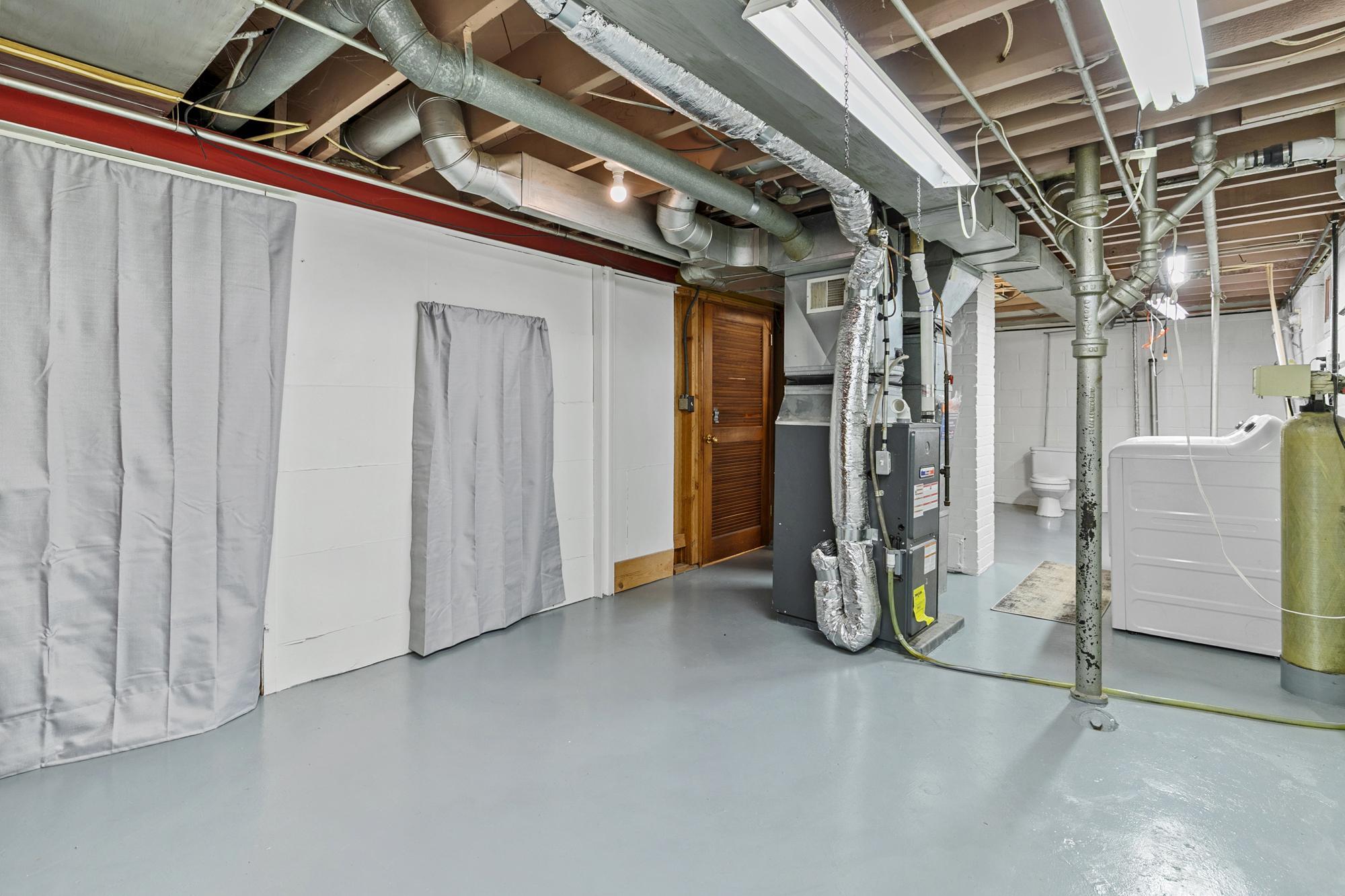 There is more storage space behind the curtains. The furnace was new in 2011.