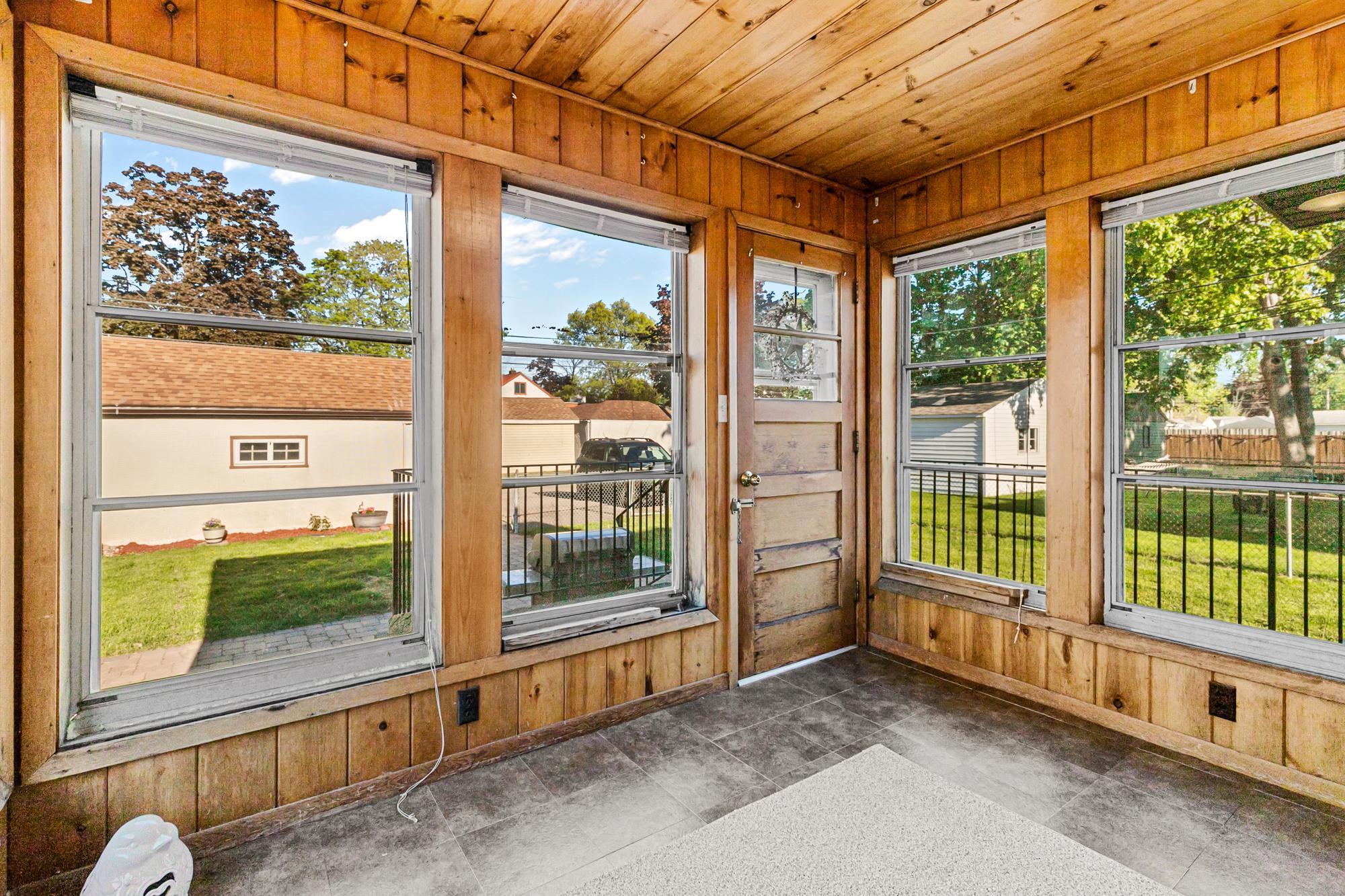 The back porch overlooks your inviting backyard.