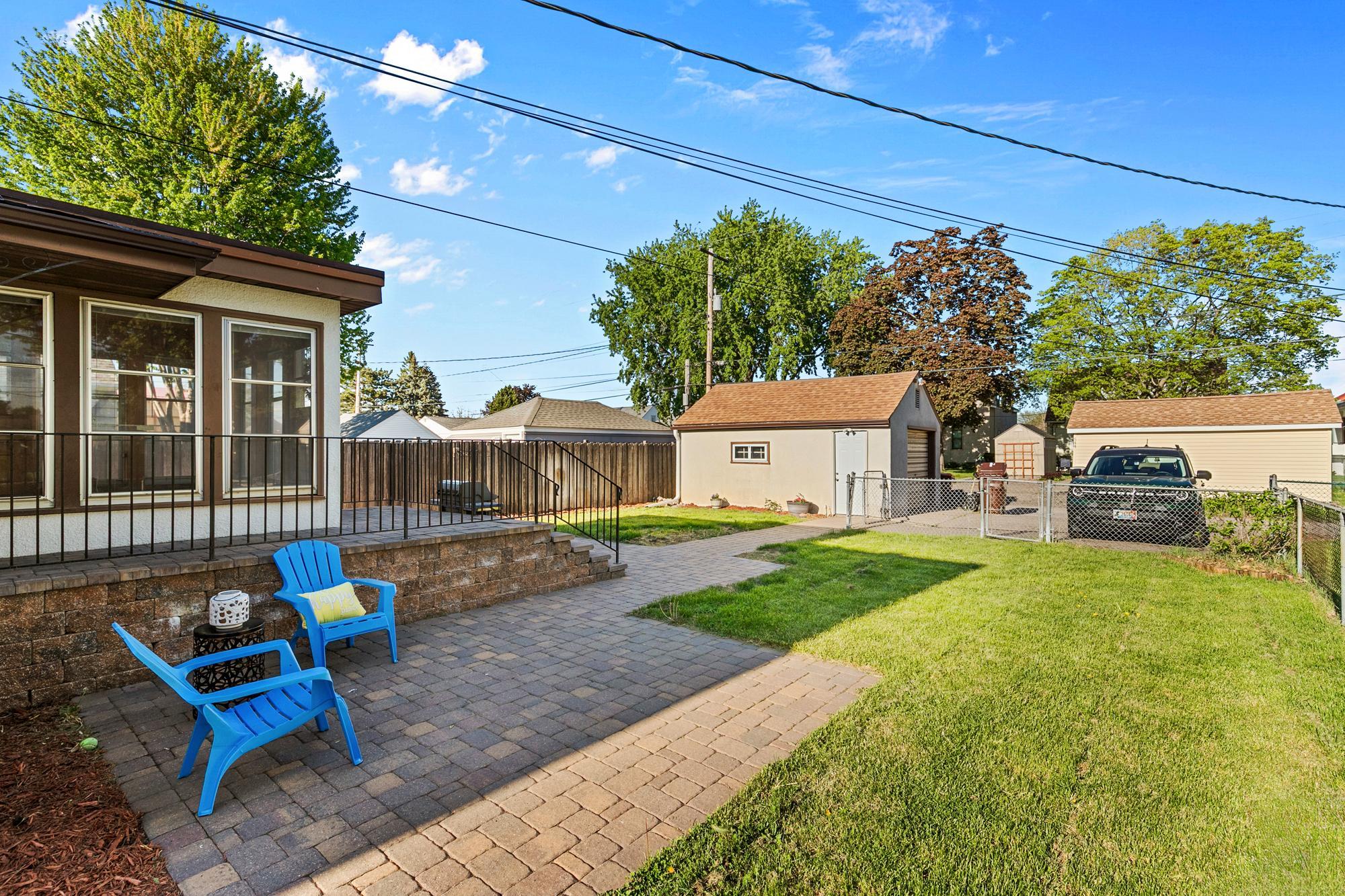 The backyard is completely fenced. There is also a parking pad for two additional cars. The garage roof was new in 2016. House roof was replaced in 2011.
