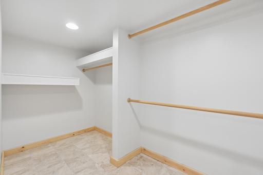 Dedicated storage area with built-ins; perfect walk-in closet setup