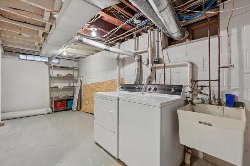 Laundry room with sink, room to work with, and SPEED QUEEN washer and dryer