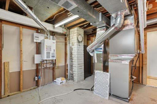 Separate utility room with tankless water heater and even more space