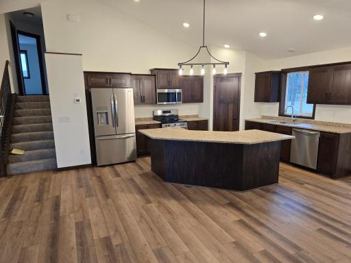 Great open concept living with LR/DR/ Kitchen on the main level. Lots of custom built popal cabinetry.