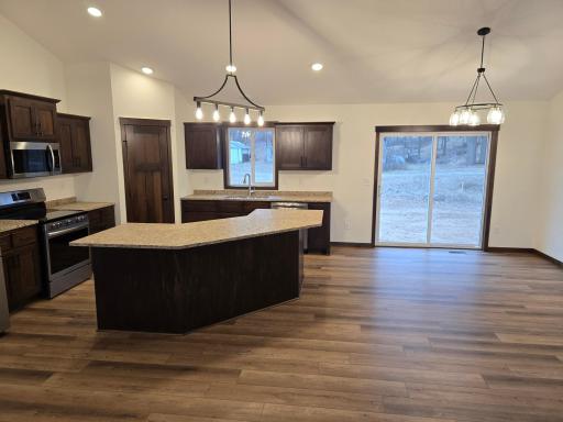 Nice sized informal dining room with sliding glass door that goes out to a future deck.