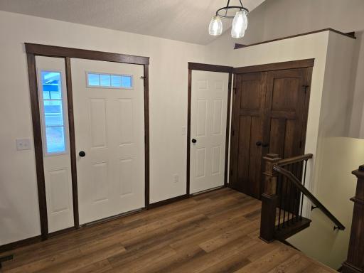 Foyer and garage entrance area with entry closet.