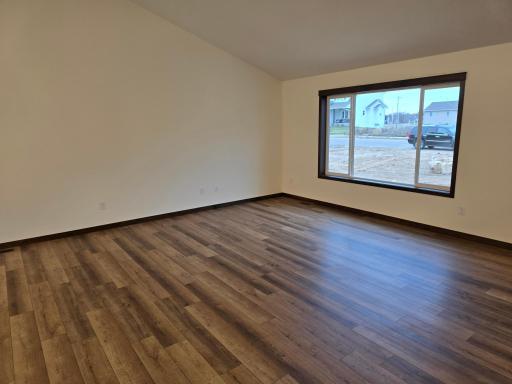 Spacious living room with large 3 wide window.