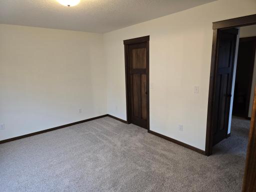 Primary bedroom entrance and walk in closet.