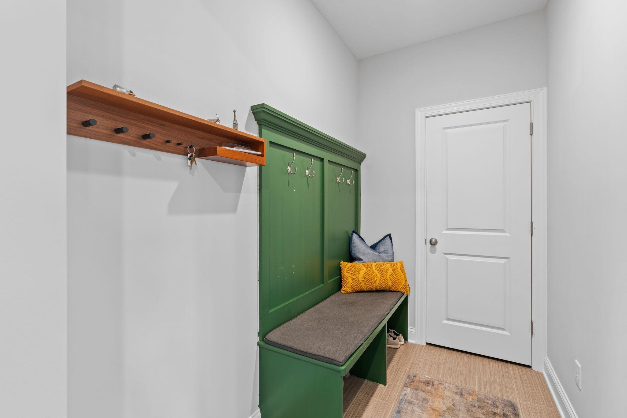 Main level drop zone headed into a HUGE 3-car, insulated garage.