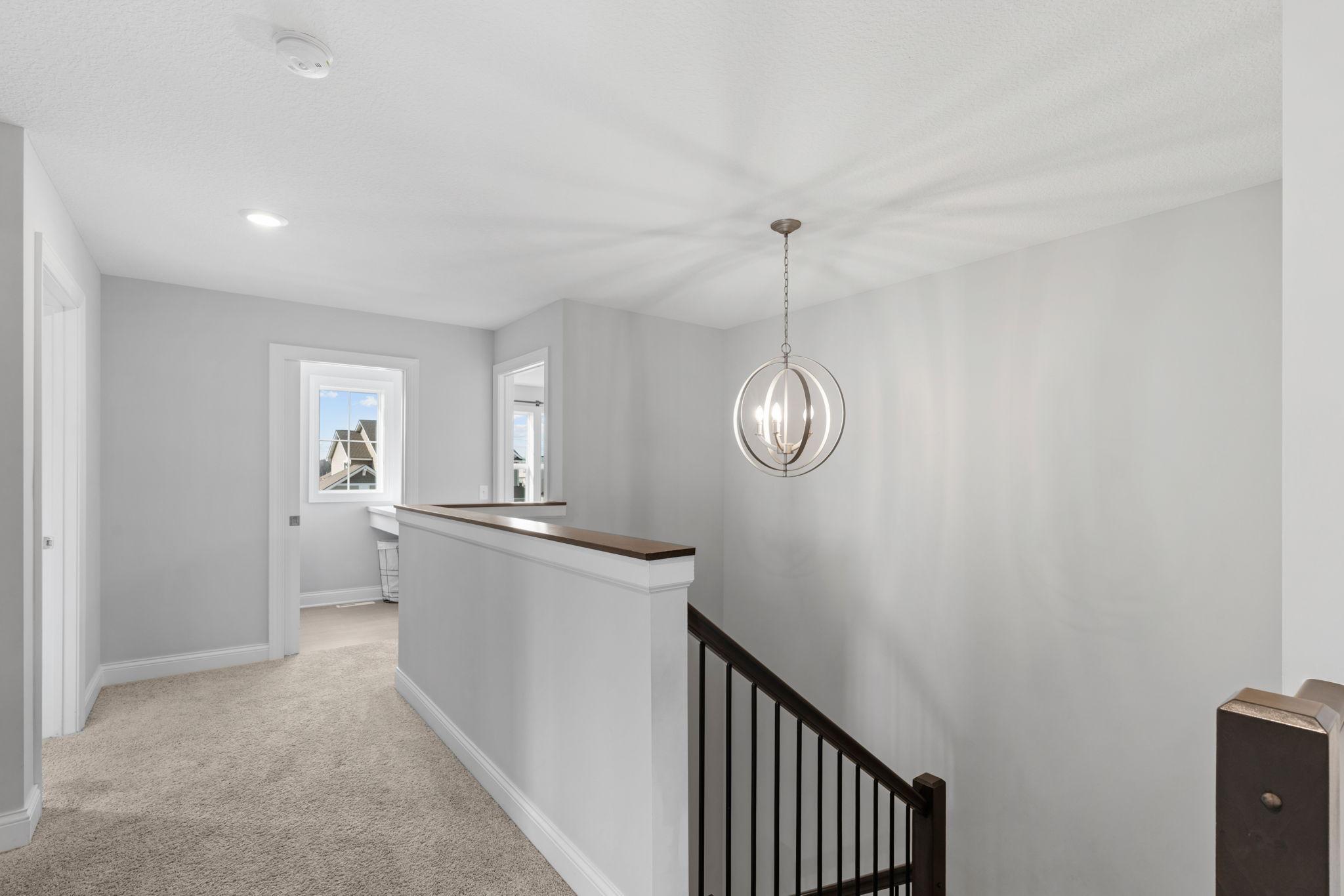 Large comfy landing area to bedrooms-great art display area!