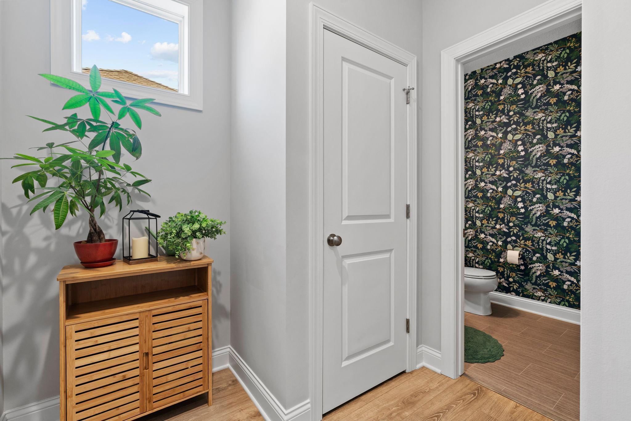 Main level half bath far away from common areas.