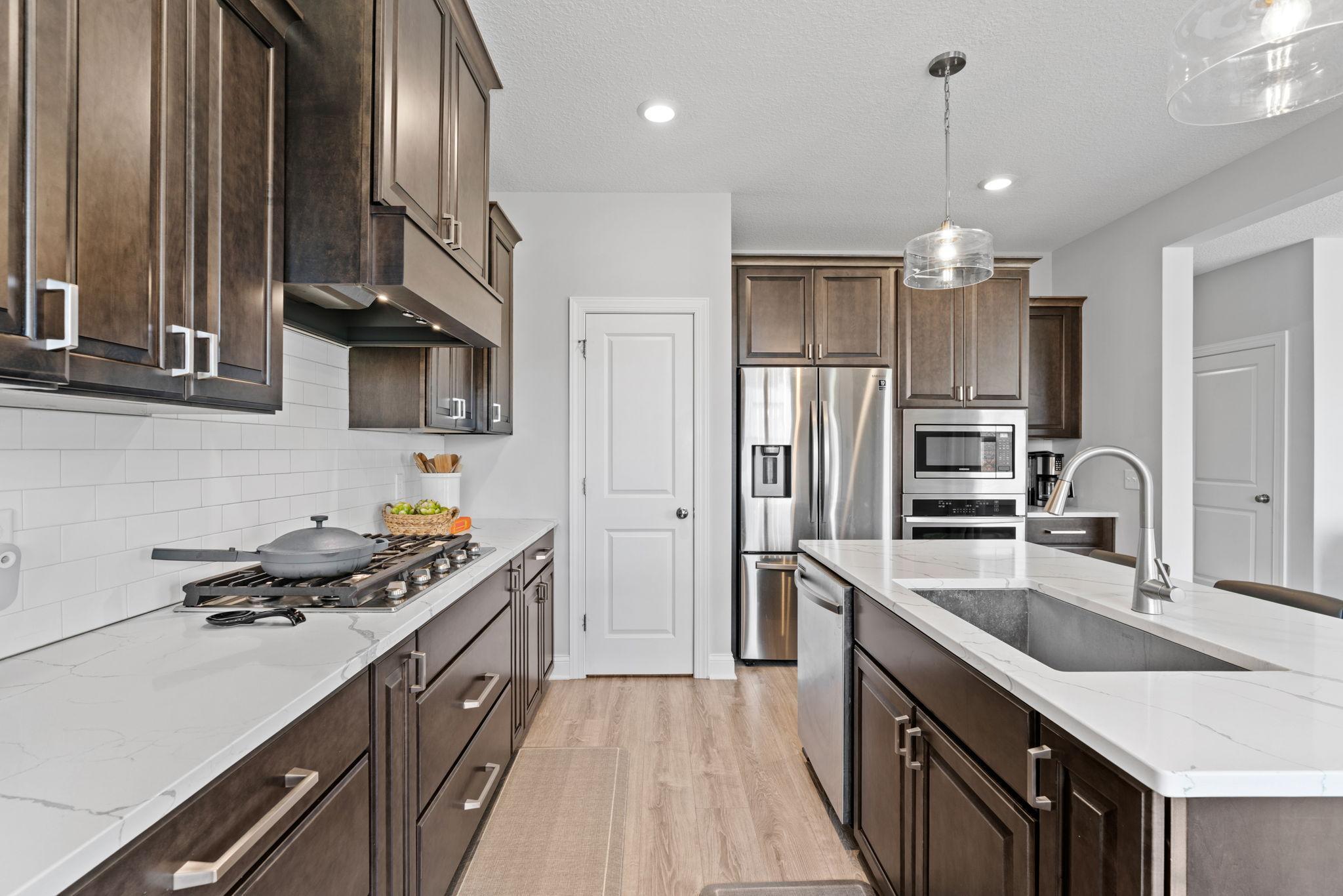 Stainless steel appliances, tons of storage, and a massive center island.