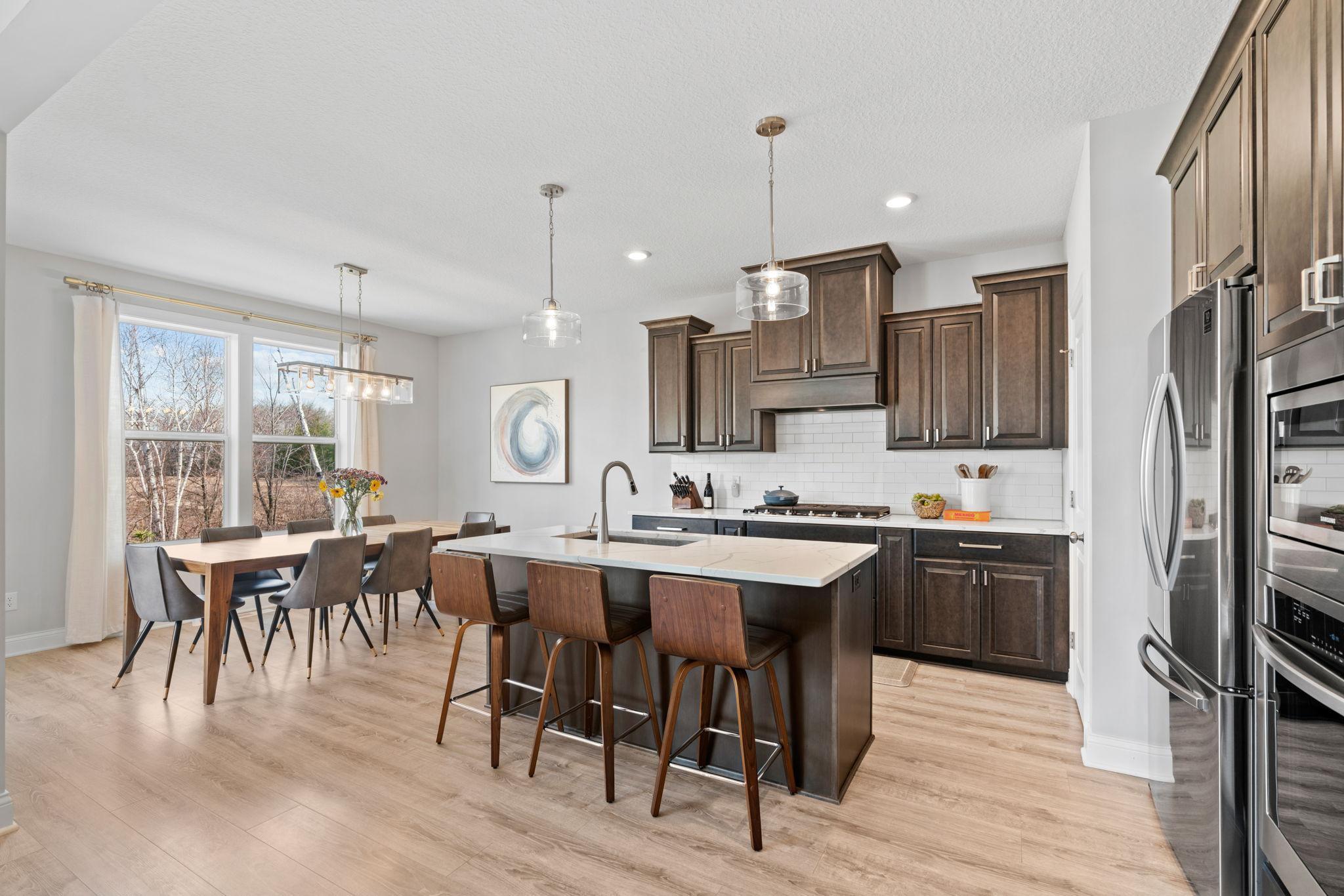 This still-new kitchen is open, luxurious, and stately.