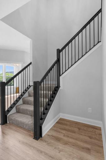 Let's head upstairs to four bedrooms and laundry!