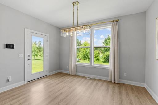 The entire rear of the home overlooks peaceful, private greenspace.