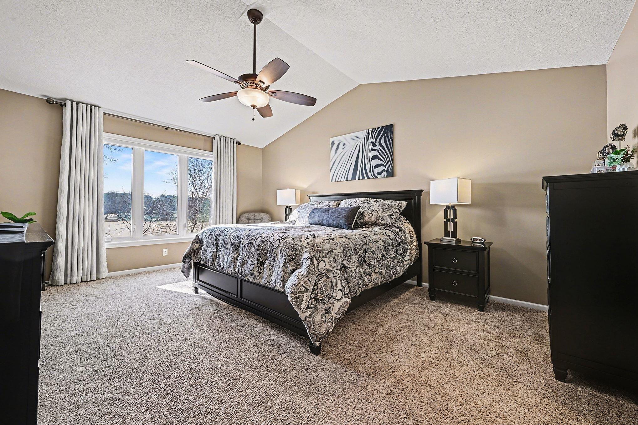 Main bedroom with fan/vaulted ceiling