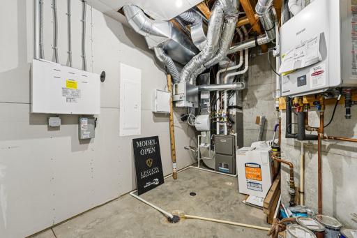 Mechanical room featuring high-efficiency systems and organized utilities, providing easy access for maintenance.