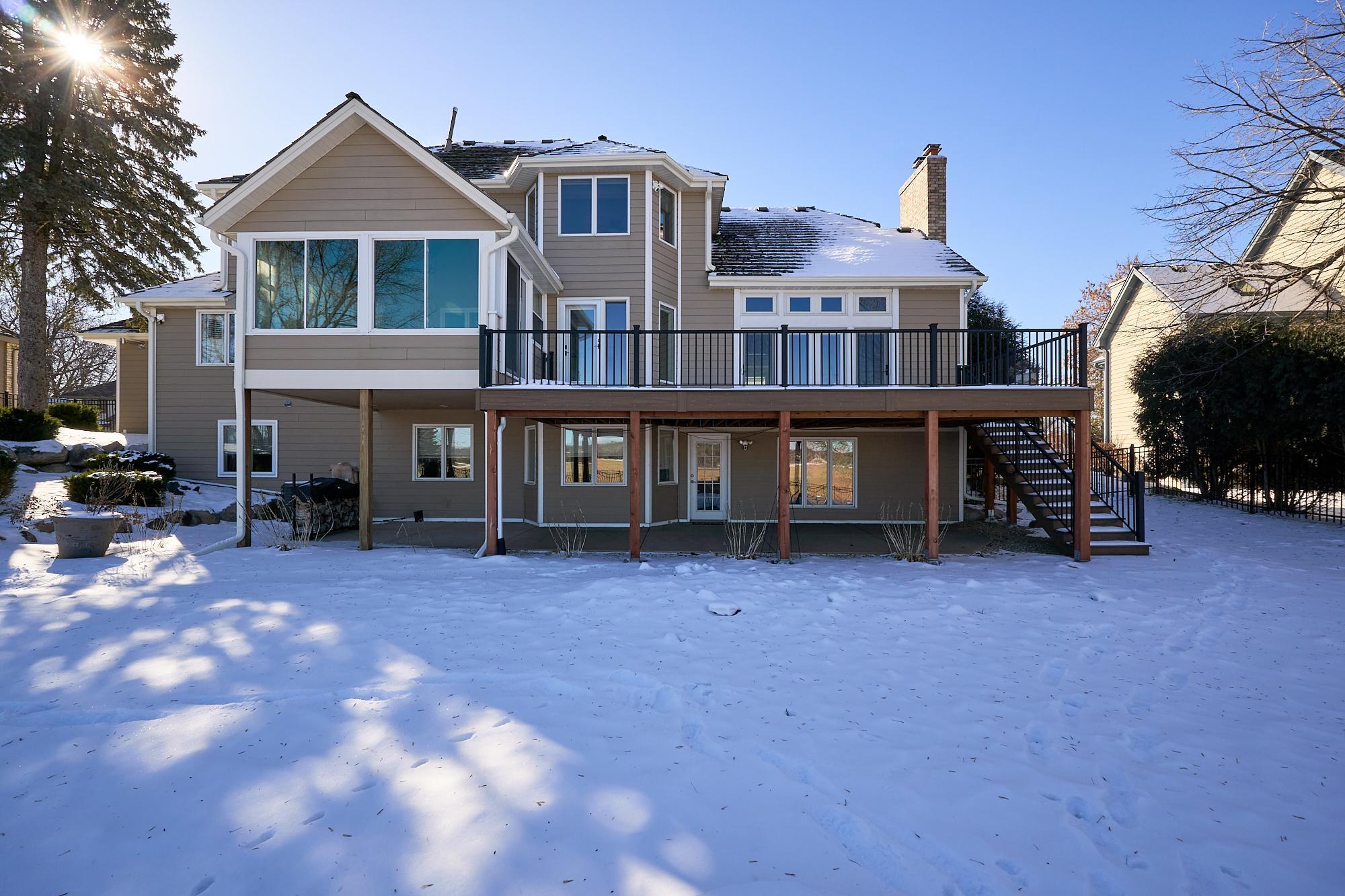 New TREX composite deck, 30' X 22'. Lighted stairs & railing posts set with a "dawn-to-dusk." timer, under-deck drainage with a gutter system flowing to underground drainage and out to the backyard wall.