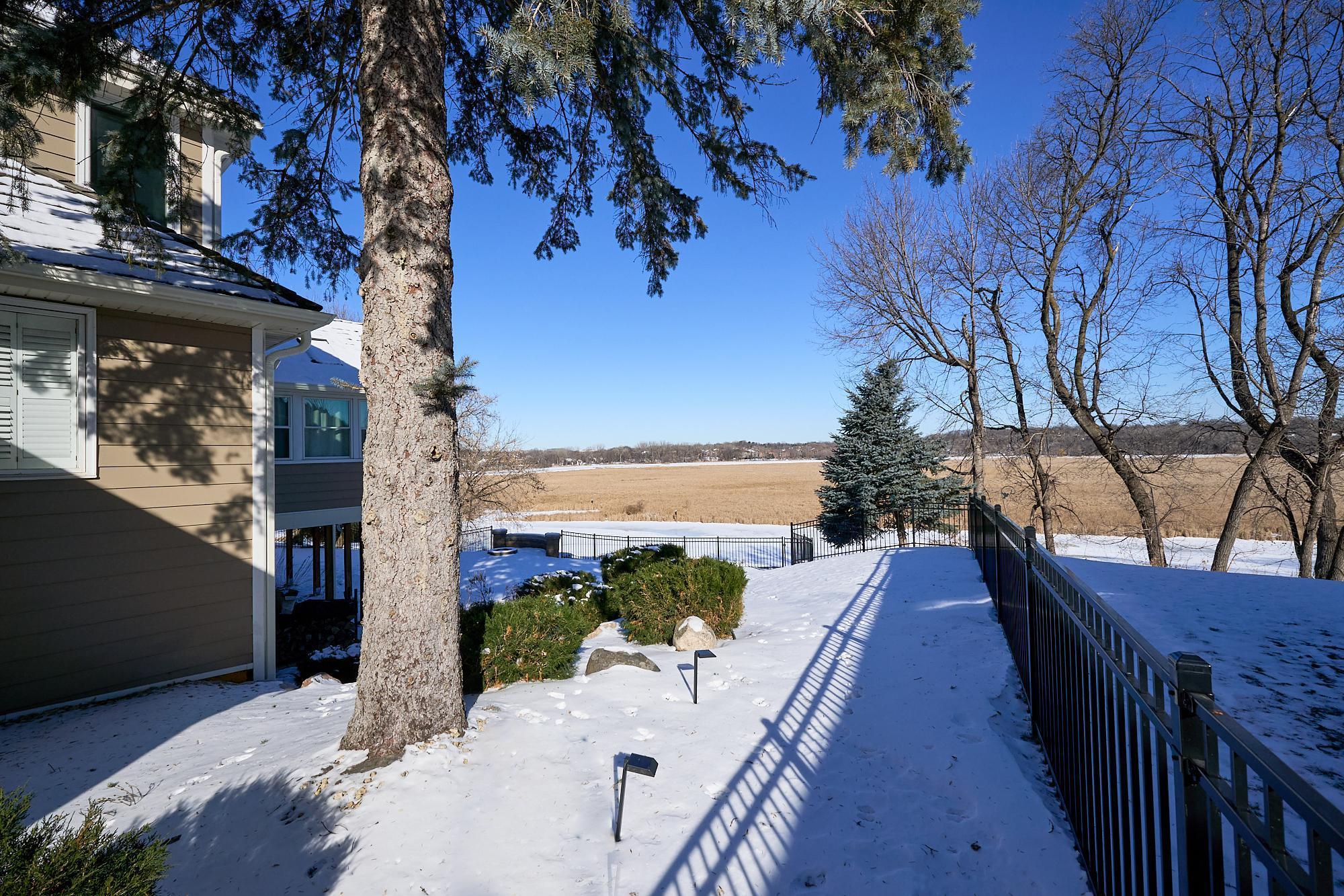 Professional landscaping includes an underground sprinkler system and landscape lighting