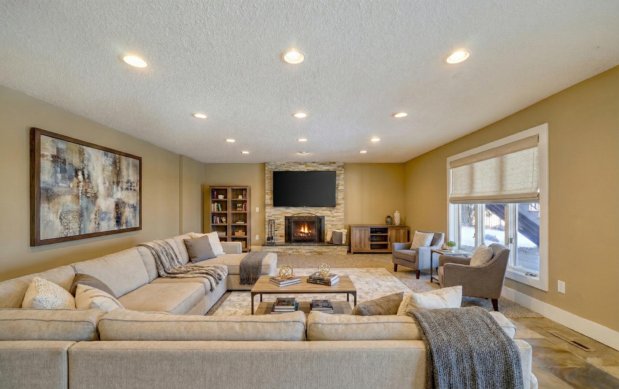 Walkout Level Family Room with Stone Gas Fireplace