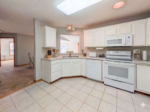 Large, clean kitchen with updated appliances