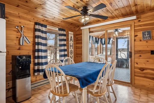 Updated light fixtures and ceiling fans throughout enhance the cozy lakefront ambiance.